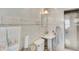 Updated bathroom with decorative tile accents, pedestal sink, and glass-enclosed shower at 7000 Beach Plz # 905, St Pete Beach, FL 33706
