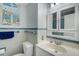 Bathroom features tile floors, updated vanity, and nautical-themed artwork at 7000 Beach Plz # 905, St Pete Beach, FL 33706