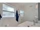 Modern bathroom with frameless shower, vessel sink, window, and elegant fixtures at 7000 Beach Plz # 905, St Pete Beach, FL 33706