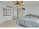 Bedroom features tile floors, a ceiling fan, and closet at 7000 Beach Plz # 905, St Pete Beach, FL 33706