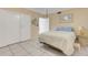 Bedroom featuring neutral walls, tile flooring, and a ceiling fan at 7000 Beach Plz # 905, St Pete Beach, FL 33706
