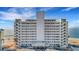 Large condo building, featuring beach access, balconies, and an inviting entryway at 7000 Beach Plz # 905, St Pete Beach, FL 33706