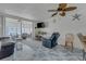 Living room featuring tile floors, casual seating, and access to a screened in porch at 7000 Beach Plz # 905, St Pete Beach, FL 33706