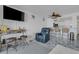 Bright living space with casual seating, tile floors, and access to the kitchen at 7000 Beach Plz # 905, St Pete Beach, FL 33706