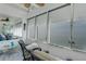 Screened porch with wicker seating and great natural light at 7000 Beach Plz # 905, St Pete Beach, FL 33706