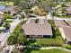 Expansive aerial view of the house, showcasing lush landscaping, mature trees, and beautiful surroundings at 7123 Heron Dr, Sarasota, FL 34243