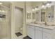 Bathroom with white cabinets, granite countertops, stand-up shower, and toilet room at 7123 Heron Dr, Sarasota, FL 34243