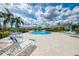 Sparkling community pool with plenty of seating, perfect for relaxation and socializing at 7123 Heron Dr, Sarasota, FL 34243