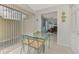Bright dining nook features table and chairs with lots of sunlight at 7123 Heron Dr, Sarasota, FL 34243
