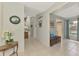 Inviting foyer with tile flooring and views into the living area at 7123 Heron Dr, Sarasota, FL 34243