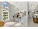 Bright kitchen with breakfast bar, granite countertops, and large arched window providing natural light at 7123 Heron Dr, Sarasota, FL 34243