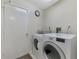 Practical laundry room featuring modern washer and dryer, with a clean and functional layout at 7123 Heron Dr, Sarasota, FL 34243