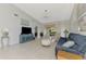 Spacious living room featuring tile floors, ceiling fan, and comfortable seating at 7123 Heron Dr, Sarasota, FL 34243
