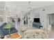 Open-concept living room with view to the kitchen and bar, plus comfortable seating at 7123 Heron Dr, Sarasota, FL 34243