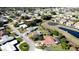 Aerial view of the property in a neighborhood with nearby lake at 7208 13Th W Ave, Bradenton, FL 34209