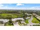 A stunning aerial view capturing an expansive neighborhood, lush greenery, and serene water features at 780 Montrose Dr # 104, Venice, FL 34293