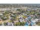 Extensive aerial view of houses in a neighborhood with diverse architectural styles and green spaces at 7807 24Th W Ave, Bradenton, FL 34209
