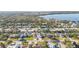 Aerial view of a neighborhood with waterfront homes and lush greenery at 7807 24Th W Ave, Bradenton, FL 34209