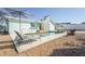 Backyard featuring an in-ground pool, seating area, and lush landscaping at 7807 24Th W Ave, Bradenton, FL 34209