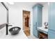 Bright bathroom featuring blue cabinets, modern sink, and stylish fixtures at 7807 24Th W Ave, Bradenton, FL 34209