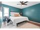 Comfortable bedroom with a bed, pillows, cozy blanket, and a window for natural light at 7807 24Th W Ave, Bradenton, FL 34209