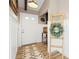 Inviting entryway featuring modern decor, stylish flooring, decorative wreath and a wooden ladder at 7807 24Th W Ave, Bradenton, FL 34209