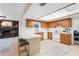 Open kitchen with white countertops, and warm wood cabinets creating a functional and inviting space at 7807 24Th W Ave, Bradenton, FL 34209