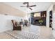 Cozy living room featuring two chairs, a modern rug, fireplace and decor at 7807 24Th W Ave, Bradenton, FL 34209