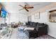 Comfortable living room with a large sofa, accent chairs, and decorative elements with a 'welcome home' sign at 7807 24Th W Ave, Bradenton, FL 34209