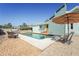 Inviting backyard pool area with lounge chairs, a charming wood deck, and a lush gravel border at 7807 24Th W Ave, Bradenton, FL 34209