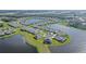 Aerial view of the neighborhood showcasing the homes nestled around picturesque lakes and beautiful landscaping at 9028 Sunray Cv, Parrish, FL 34219
