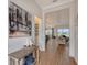 Open-concept floor plan with wood floors, views into the living and dining areas at 9028 Sunray Cv, Parrish, FL 34219