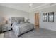 Spacious main bedroom featuring a large bed and an ensuite bath with water views at 9028 Sunray Cv, Parrish, FL 34219