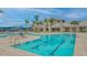 Large swimming pool with lane markers and lounge seating, offering a refreshing and relaxing experience at 9028 Sunray Cv, Parrish, FL 34219