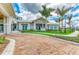 Exterior view of the Driftwood clubhouse featuring well-maintained landscaping and an American flag at 9339 Ballaster Pointe Loop, Parrish, FL 34219