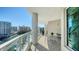 Enjoy city views from this condo balcony, complete with a seating area at 990 Blvd Of The Arts # 1203, Sarasota, FL 34236