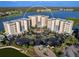 Beautiful aerial view of luxury condos, manicured landscaping, and ample parking in a tranquil waterfront setting at 10520 Boardwalk Loop # 205, Lakewood Ranch, FL 34202