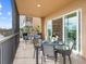 Inviting balcony with a waterfront view and seamless transition to the interior living space at 10520 Boardwalk Loop # 205, Lakewood Ranch, FL 34202