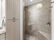 Stylish bathroom features a walk-in shower, built in cabinets and neutral colors at 10520 Boardwalk Loop # 205, Lakewood Ranch, FL 34202