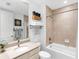 Bright bathroom features a tub/shower combo, and granite countertop at 10520 Boardwalk Loop # 205, Lakewood Ranch, FL 34202