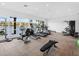 Community gym with weights and cardio machines features beautiful views of the lake at 10520 Boardwalk Loop # 205, Lakewood Ranch, FL 34202