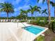 Inviting hot tub surrounded by lush landscaping and comfortable lounge chairs at 10520 Boardwalk Loop # 205, Lakewood Ranch, FL 34202