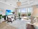 Stylish living room with water view, sleek furniture, modern decor, and plenty of space at 10520 Boardwalk Loop # 205, Lakewood Ranch, FL 34202