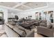 Elegant lounge featuring stylish seating, modern decor, and access to a fully equipped kitchen and outdoor patio at 10520 Boardwalk Loop # 205, Lakewood Ranch, FL 34202