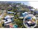 Attractive neighborhood with a mix of housing styles, lush landscaping, and a community pool, offering a vibrant lifestyle at 1103 Palma Sola Blvd, Bradenton, FL 34209