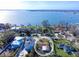 Charming waterfront homes with private docks on a sunny day, boasting stunning views and serene coastal living at 1103 Palma Sola Blvd, Bradenton, FL 34209