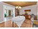 Cozy dining area with classic chandelier and wood accents at 1103 Palma Sola Blvd, Bradenton, FL 34209