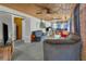 Bright living room featuring paneled wood ceiling, multiple sofas, and large windows at 1103 Palma Sola Blvd, Bradenton, FL 34209