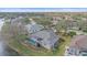 Backyard view with a screened in pool, landscaping, and a water view at 11910 Soft Rush Ter, Lakewood Ranch, FL 34202