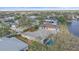 Home overlooking a serene lake, featuring a screened lanai, and mature trees at 11910 Soft Rush Ter, Lakewood Ranch, FL 34202